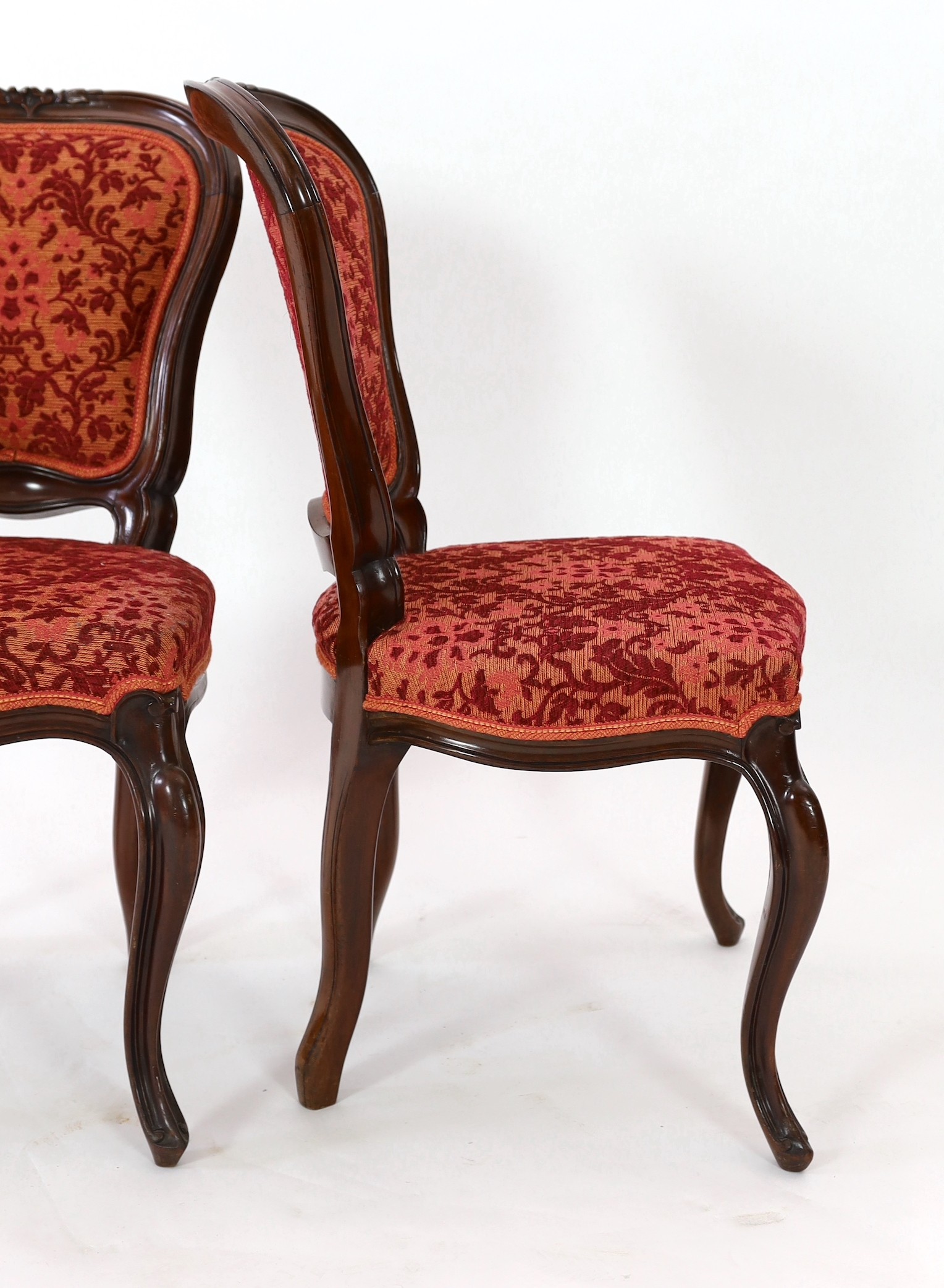 A set of twelve Victorian mahogany balloon back dining chairs, W.50cm D.46cm H.89cm